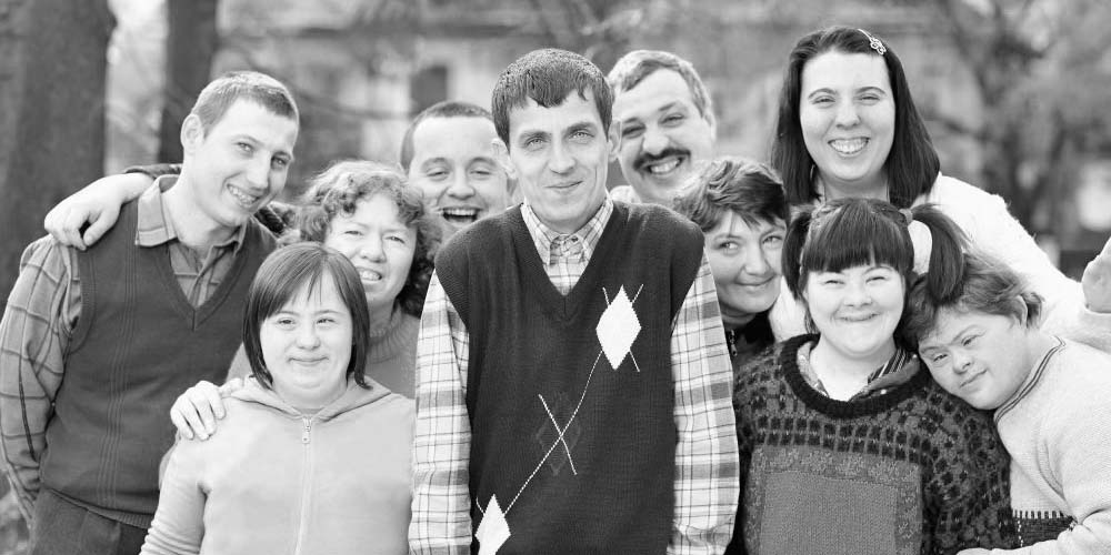 group of happy people with disabilities