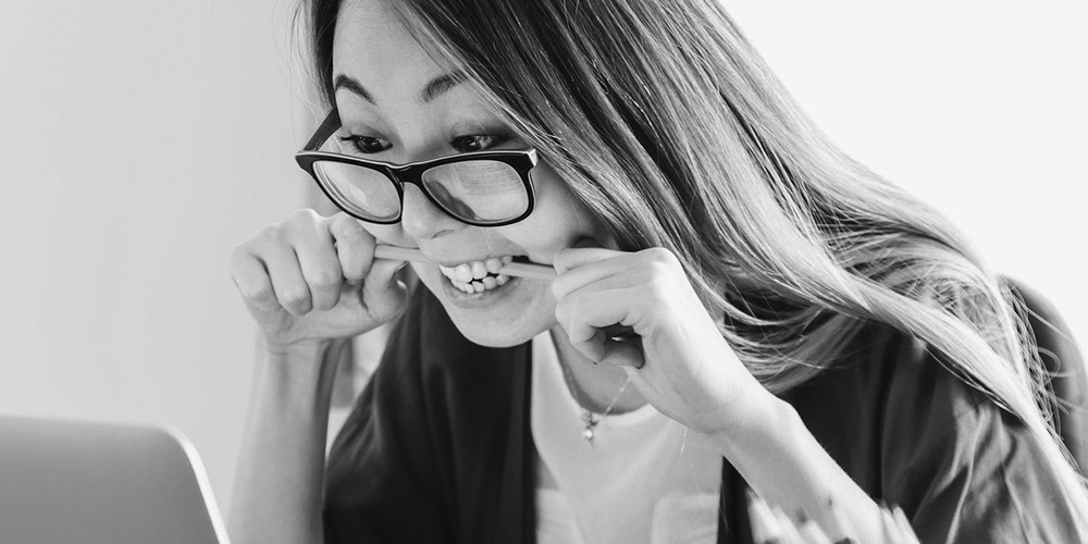 Frustrated woman at laptop